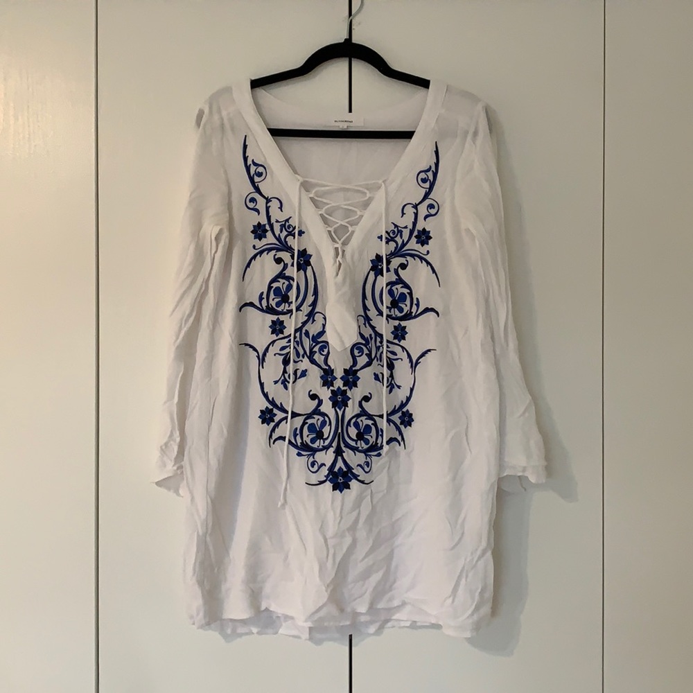 White, long sleeved mini dress. Great as a dress or over a swimsuit
